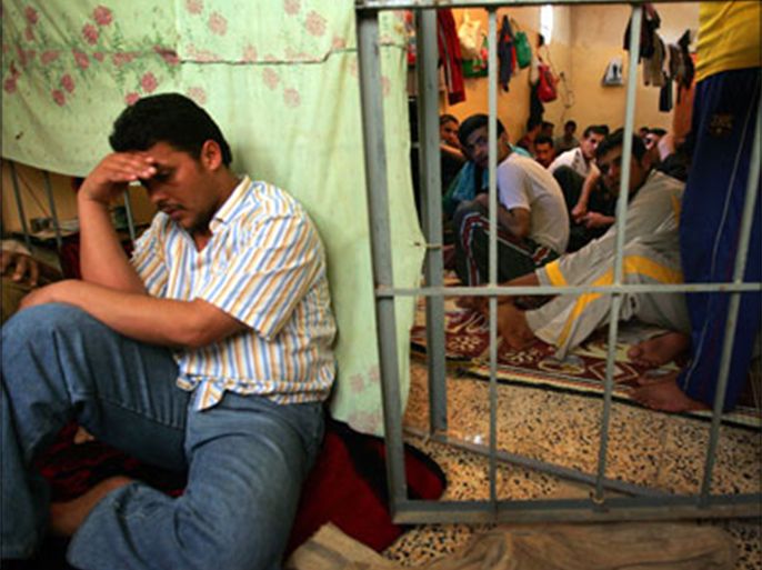 afp : Iraqi prisoners sit in a cramped cell at a local police station in the restive Diyala Province, located northeast of Baghdad, on March 25, 2008. Moqtada al-Sadr's militiamen