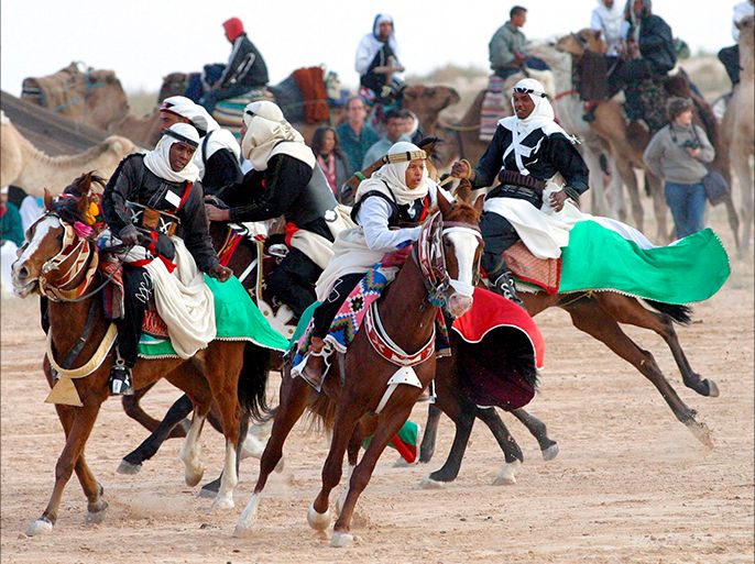 epa : epa01585454 Horsemen perform during the opening of the Sahara International Festival in Douz, south-western Tunisia, on December 25 2008. The 41st International