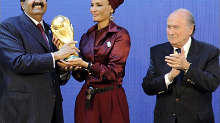 Emir of the State of Qatar Sheikh Hamad bin Khalifa Al-Thani (R) and his wife Sheikha Moza bint Nasser Al-Missned (C) receive the World Cup trophy from Fifa President Joseph Blatter after the official announcement that Qatar will host the 2022 World Cup on December 2, 2010 at the FIFA headquarters in Zurich. AFP PHOTO / SEBASTIEN DERUNGS