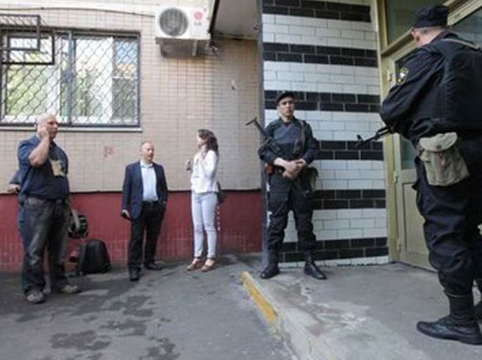 Police officers armed with automatic rifles stand near the house where an opposition leader Alexei Navalny has his flat in Moscow, Russia 11 June 2012. Police has searched apartments of a number of opposition leaders, including Alexei Navalny, Sergei Udaltsov, Ilya Yashin, Boris Nemtsov.An opposition rally called the 'March of Millions on Day of Russia takes place on 12 June after being given the green light by city authorities.
