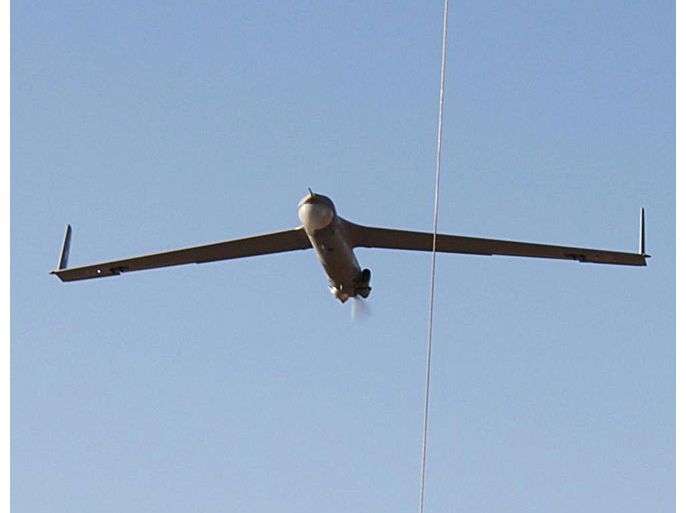 This June 29, 2011 US Army handout image shows a ScanEagle surveillance drone flying into a retrieval wire at Camp Taji, Iraq. The United States will speed up delivery of missiles and surveillance drones to Iraq as the Baghdad government battles a resurgence of Al-Qaeda linked militants, a Pentagon spokesman said January 6, 2014. "We are ... looking to accelerate the FMS (Foreign Military Sales) deliveries with an additional 100 Hellfire missiles ready for delivery this spring," Colonel Steven Warren said. An additional 10 ScanEagle surveillance drones would also be delivered he said. AFP PHOTO / Handout / US Army / Spc. Darriel Swatts
