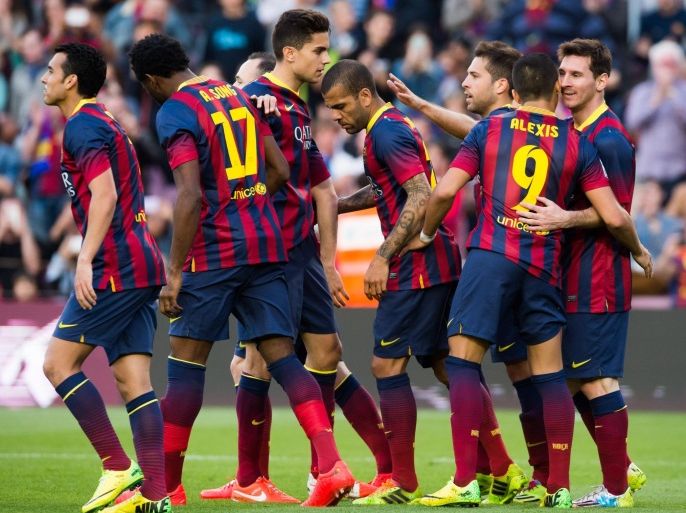 BARCELONA, SPAIN - MARCH 16: Lionel Messi (R) of FC Barcelona is congratulated by his team mates (L-R) Pedro Rodriguez, Alex Song, Marc Bartra, Daniel Alves, Jordi Alba and Alexis Sanchez after scoring his team's fourth goal and his 370th goal for FC Barcelona and therfore becoming the maximum scorer in the history of FC Barcelona during the La Liga match between FC Barcelona and CA Osasuna at Camp Nou on March 16, 2014 in Barcelona, Spain.
