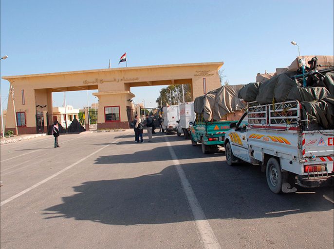 epa02752043 (FILE) A file photograph dated 28 December 2008 shows trucks loaded with supplies waiting at the Egypt-Gaza border crossing (background) at Rafah, Egypt. According to media sources, the Egyptian government announced on 25 May 2011 that Egypt's border crossing with the Gaza Strip will be opened permanently, starting 28 May. The government said the move would help to end the Palestinian division and achieve national reconciliation for Palestinians. The government of ousted president Hosni Mubarak, who was forced to step down on 11 February, had restricted movement of people and goods from the enclave. EPA/STR