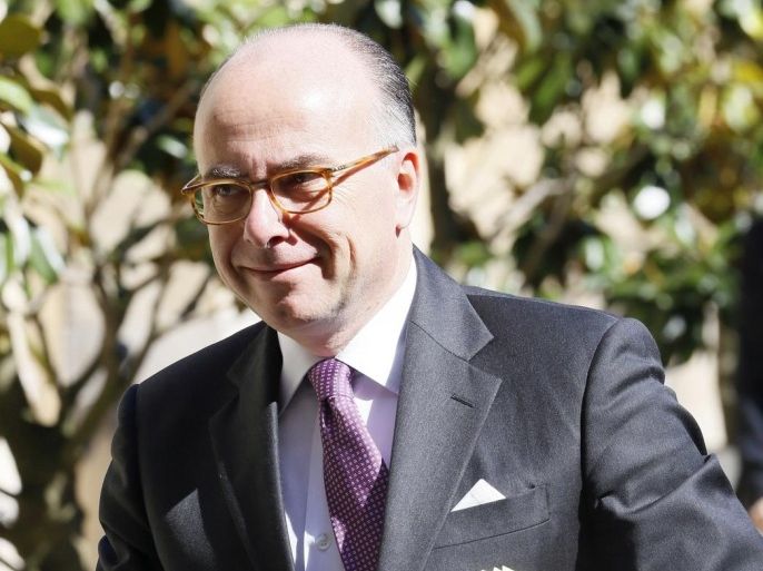 French Interior minister Bernard Cazeneuve arrives at the hotel Matignon before a cabinet meeting, on May,15, 2014 in Paris. AFP PHOTO / PATRICK KOVARIK