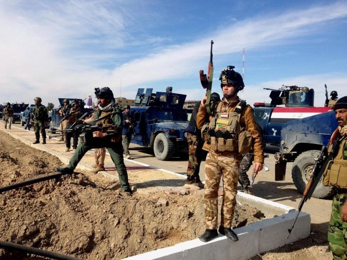 FILE -- This Feb. 2, 2014, file photo shows Iraqi Security forces preparing to attack al-Qaida positions in Ramadi, 70 miles (115 kilometers) west of Baghdad, Iraq. Militants, many from the al-Qaida-breakaway group Islamic State in Iraq and the Levant, overran Fallujah and parts of Anbar’s capital, Ramadi, at the beginning of 2014, and since then government forces, backed by Sunni tribal fighters opposed to al-Qaida, have battled the militants with little success. According to the Obama administration’s most recent terrorism report, released by the State Department in late April, al-Qaida's core leadership has been degraded, limiting its ability to launch attacks and lead its followers. This has resulted in more autonomous and more aggressive affiliates, notably in Yemen, Syria, Iraq, northwest Africa and Somalia, according to the report, which recorded a 43 percent increase in terrorist attacks worldwide from 2012 to 2013. (AP Photo, File)
