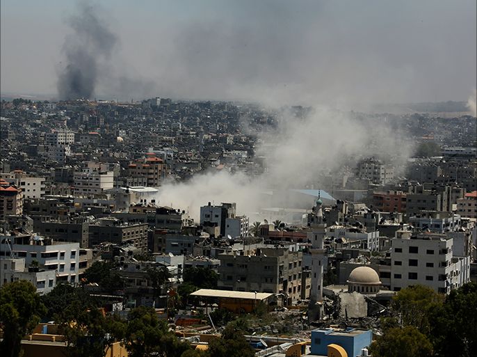 epa04328715 Smoke rises after an Israeli air strike in Gaza City during a military operation in the east of Gaza City, 24 July 2014. At least 23 Palestinians were killed before dawn 24 July 2014 on the 17th day of the Israeli offensive in the Gaza Strip amid reports that both sides in the conflict might be inclined towards accepting a five-day humanitarian truce. EPA/MOHAMMED SABER
