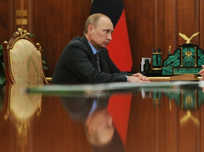 Russian President Vladimir Putin looks on during a meeting with Head of the Jewish Autonomous Region Alexander Vinnikov (not pictured) at the Kremlin in Moscow, Russia, 25 July 2014. EPA/MIKHAIL KLIMENTYEV / RIA NOVOSTI / KREMLIN POOL MANDATORY CREDIT