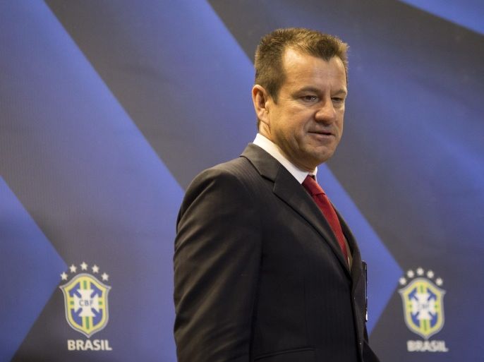 Brazil soccer coach Dunga, arrives to a press conference announcing him as the new head coach of the Brazilian national team, in Rio de Janeiro, Brazil, Tuesday, July 22, 2014. Dunga returned to the post replacing Luiz Felipe Scolari, who resigned after Brazil failed to win the 2014 World Cup eliminated in a 7-1 loss to Germany in the semifinals. (AP Photo/Felipe Dana)