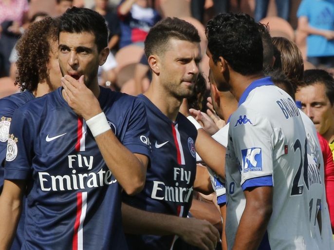 Paris Saint Germain's Thiago Motta, center and Bastia's Brandao, right, greets each other prior to the kick-off of a French League One soccer Match Paris Saint Germain against Bastia, while Argentinian Javier Pastore,left, stands next to them, at Parc des Princes stadium, in Paris, Saturday, Aug. 16. 2014. Paris Saint-Germain President Nasser Al-Khelaifi wants Brandao to be banned for life after the Bastia striker headbutted Thiago Motta at the end of a French league match on Saturday. After Bastia's 2-0 loss to PSG, Brandao waited for Thiago Motta in the tunnel and headbutted the midfielder, leaving him with blood running down from his nose. Al-Khelaifi said the Italian had a broken nose, although the club had not disclosed any injury details. (AP Photo/Michel Euler)