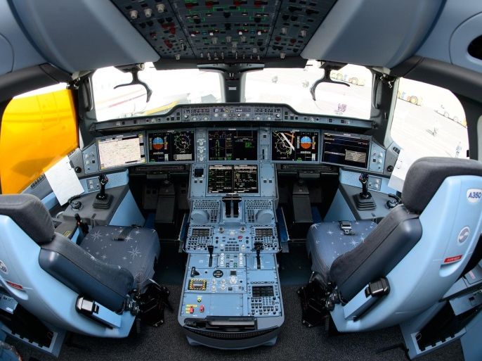 The interior view of the flight deck, or cockpit, of an Airbus A350XWB test plane is pictured at the Farnborough Air Show in Hampshire, southern England, on July 16, 2014. European aircraft maker Airbus won orders for its passenger planes from leasing companies worth about $25 billion at the Farnborough airshow on Tuesday, far outpacing its US rival Boeing. AFP PHOTO/Leon Neal