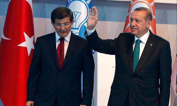 Turkey's President-elect Erdogan and incoming PM Davutoglu leave the stage together during the Extraordinary Congress of the ruling AK Party (AKP) in Ankara