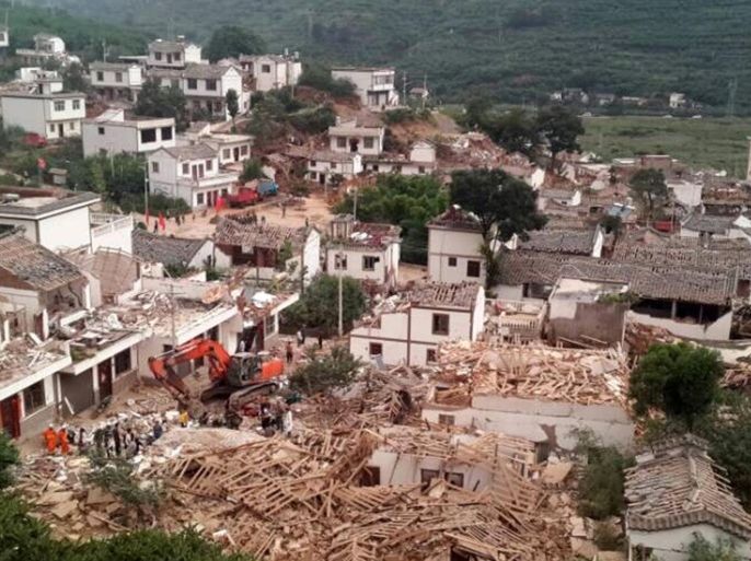 A general view shows collapsed houses after an earthquake hit Ludian county, Yunnan province August 3, 2014. A magnitude 6.5 earthquake struck southwestern China on Sunday, killing at least 150 people in a remote mountainous area of Yunnan province, causing some buildings, including a school, to collapse, Xinhua News Agency reported. REUTERS/China Daily (CHINA - Tags: DISASTER ENVIRONMENT TPX IMAGES OF THE DAY) CHINA OUT. NO COMMERCIAL OR EDITORIAL SALES IN CHINA