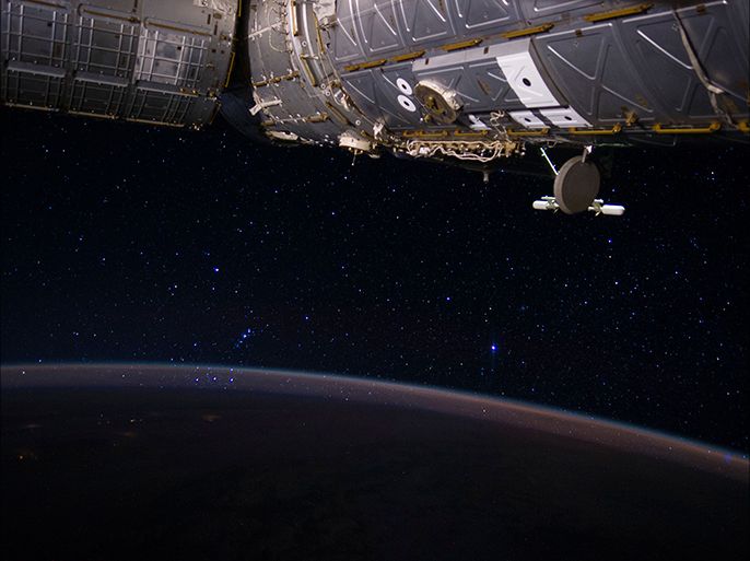 A picture released by NASA on 25 June 2014 shows a view out of the International Space Station (ISS) taken by Expedition 40 Flight Engineer Reid Wiseman on 23 June 2014. Among the 'stellar' scene is part of the constellation Orion, seemingly rising through the Earth's atmosphere, near the center of the frame. The US laboratory part of the ISS, Destiny, is seen in the upper right. EPA/Reid Wiseman / NASA HANDOUT EDITORIAL USE ONLY