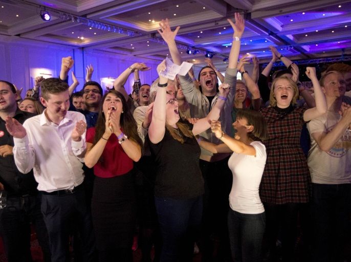 No supporters for the Scottish independence referendum celebrate a result at a No campaign event at a hotel in Glasgow, Scotland, early Friday, Sept. 19, 2014. From the capital of Edinburgh to the far-flung Shetland Islands, Scots embraced a historic moment ó and the rest of the United Kingdom held its breath ó after voters turned out in unprecedented numbers for an independence referendum that could end the country's 307-year union with England. (AP Photo/Matt Dunham)