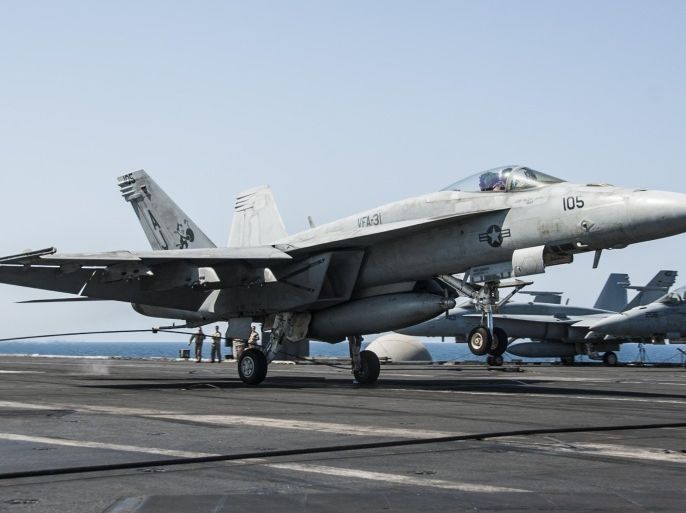 An F/A-18E Super Hornet attached to the Tomcatters of Strike Fighter Squadron (VFA) 31 lands aboard the aircraft carrier USS George H.W. Bush (CVN 77) after conducting strike missions against the Islamic State of Iraq and the Levant (ISIL), also known as the Islamic State, targets, in the Gulf, September 23, 2014, in this handout picture courtesy of the U.S. Navy. The U.S. and its Arab allies bombed militant groups in Syria for the first time on Tuesday, killing scores of Islamic State fighters, members of a separate al Qaeda-linked group and opening a new front amid shifting Middle East alliances. The USS George H.W. Bush is supporting maritime and theatre security operations in the U.S. 5th Fleet area of responsibility. Picture taken September 23. REUTERS/Mass Communication Specialist 3rd Class Brian Stephens/U.S. Navy/Handout via Reuters (MID-SEA - Tags: MARITIME POLITICS MILITARY CIVIL UNREST CONFLICT TRANSPORT) ATTENTION EDITORS - THIS PICTURE WAS PROVIDED BY A THIRD PARTY. REUTERS IS UNABLE TO INDEPENDENTLY VERIFY THE AUTHENTICITY, CONTENT, LOCATION OR DATE OF THIS IMAGE. FOR EDITORIAL USE ONLY. NOT FOR SALE FOR MARKETING OR ADVERTISING CAMPAIGNS. THIS PICTURE IS DISTRIBUTED EXACTLY AS RECEIVED BY REUTERS, AS A SERVICE TO CLIENTS