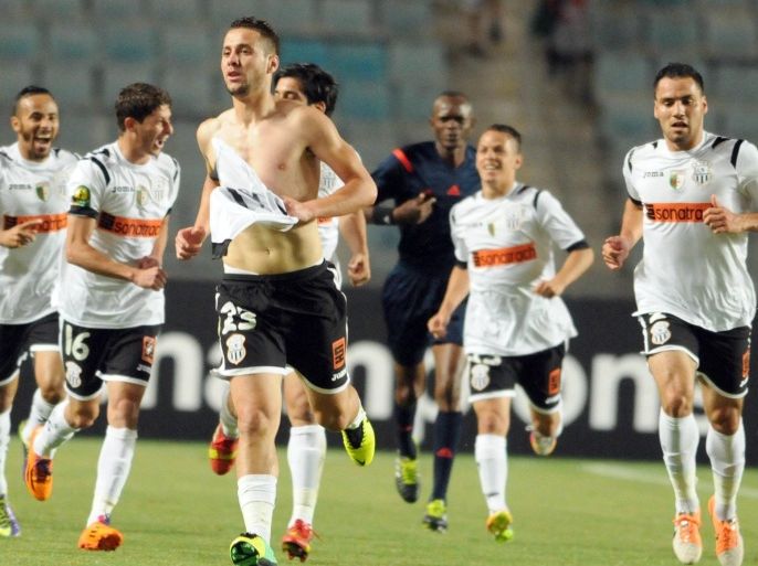 Algeria's ES Setif players celebrate after Najid Rachid (#23) scored a goal against Esperance of Tunis during their CAF Champions League football match on May 17, 2014 at the Olympic Stadium in the Tunisian port city of Rades. ES Setif won 2-1. AFP PHOTO / SALAH HABIBI