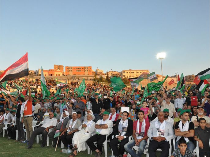 الحشود ترفع أعلام فلسطيني ودول الربيع العربي بمهرجان " الأقصى في خطر" التاسع عشر الذي أقيم بأم الفحم بالداخل الفلسطيني بـ 12 من شهر سبتمبر‎-أيلول.