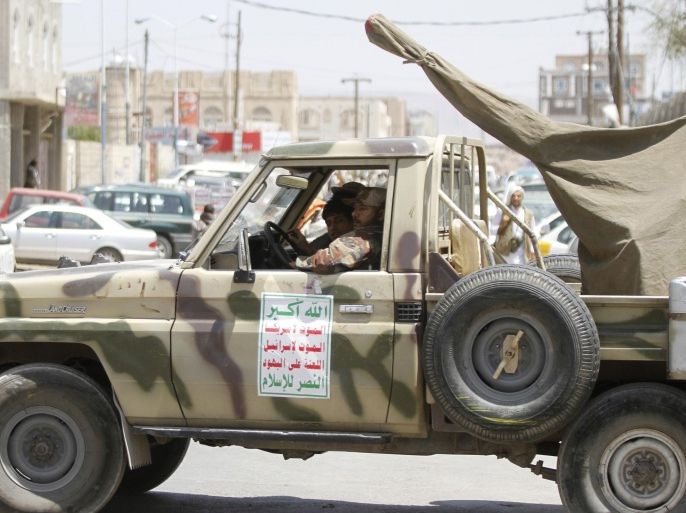 Shi'ite Houthi militants sit in a patrol vehicle, which is equipped with an anti-aircraft machine gun and was taken from the army recently, during a rally in Sanaa September 26, 2014. President Abd-Rabbu Mansour Hadi has warned Yemenis their country is heading towards civil war after the takeover of the capital by Shi'ite Muslim rebels, a move that has allowed the insurgents to dictate terms to a weakened, fractured government. REUTERS/Mohamed al-Sayaghi (YEMEN - Tags: POLITICS CIVIL UNREST MILITARY)