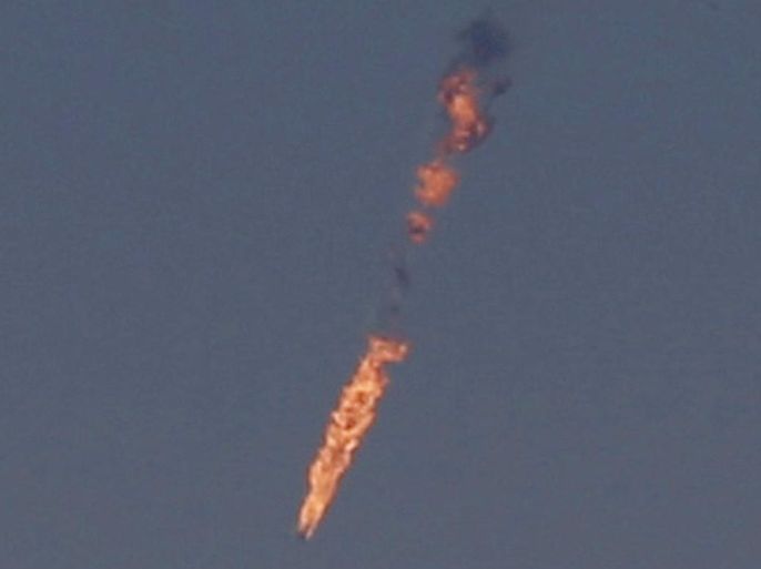 A Syrian fighter jet is seen in flames after it was hit by the Israeli military over the Golan Heights on September 23, 2014. Israel shot down a Syrian fighter jet over the Golan Heights, the army said, indicating that it had crossed the ceasefire line into the Israeli-occupied sector. It was the most serious incident to take place on the strategic plateau since the outbreak of the Syrian civil war in 2011. AFP PHOTO/ JALAA MAREY
