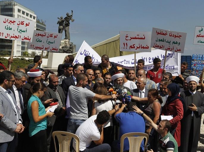 Relatives of Lebanese soldiers kidnapped by fighters linked to the radical Sunni Islamic State (IS) and al-Nusra Front (JAN), speak to the media next to the protest tent they have erected in Martyrs' Square in Beirut, Lebanon, 10 September 2014. According to media reports, 29 soldiers were abducted following clashes between Lebanese security forces and militants suspected of being part of JAN and IS that erupted on 02 August near the town of Arsal close to the Syrian border, a statement was released by militants 30 August saying nine soldiers would be killed if Islamist prisoners held by Lebanon were not released following which five Lebanese soldiers were released 31 August though 24 are still being held and one was beheaded 06 September for allegedly trying to escape.