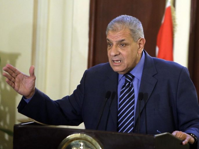 Egyptian Prime Minister Ibrahim Mahlab speaks during a a televised news conference at his office in Cairo, Egypt, Saturday, July 5, 2014. Mahlab on Saturday defended his government's decision to introduce a steep rise in fuel prices, saying energy subsidies have over the past decade cost the treasury a staggering 687 billion pounds (nearly $100 billion) that could have been used to bolster essential services. (AP Photo/Amr Nabil)