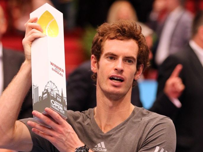 Andy Murray of Britain holds the trophy after winning teh final match against David Ferrer of Spain at the Erste Bank Open tennis tournament in Vienna, Austria, Sunday, Oct. 19. 2014. (AP Photo/Ronald Zak)