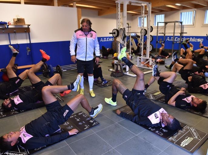 TRENTO, ITALY - JULY 30: Players of Palermo exercise in a gym during a US Citta di Palermo training session on July 30, 2014 in Storo near Trento, Italy.