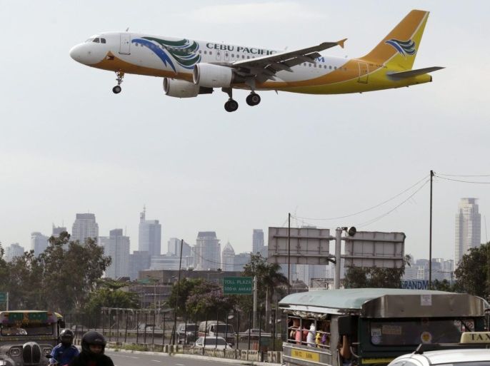 A Cebu Pacific (CEB) airplane lands at Manila's international airport, Philippines, 16 June 2014. Budget carrier Cebu Pacific will start long-haul flights from Manila to Sydney, Australia and Manila to Kuwait in September 2014.