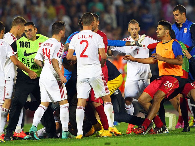 epa04446864 A brawl between players on the pitch before the UEFA EURO 2016 group I qualifying soccer match between Serbia and Albania is suspended in Belgrade, Serbia, 14 October 2014. EPA/KOCA SULEJMANOVIC