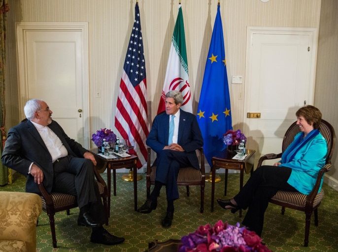 NEW YORK, NY - SEPTEMBER 26: U.S. Secretary of State John Kerry (C) meets with Iranian Foreign Minister Mohammad Javad Zarif (L) and EU High Representative Lady Catherine Ashton on September 26, 2014 in New York City. After decades of icy relationships, U.S.-Iranian relations have recently found mutual interests in attacking the Islamic State of Iraq and Syria, also known as ISIS.