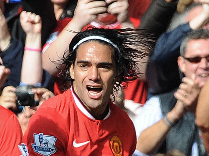 epa04432986 Manchester United's Radamel Falcao (R) celebrates after scoring the 2-1 goal during the English Premier League soccer match between Manchester United and Everton at the Old Trafford in Manchester, Britain, 05 October 2014. EPA/PETER POWELL DataCo terms and conditions apply