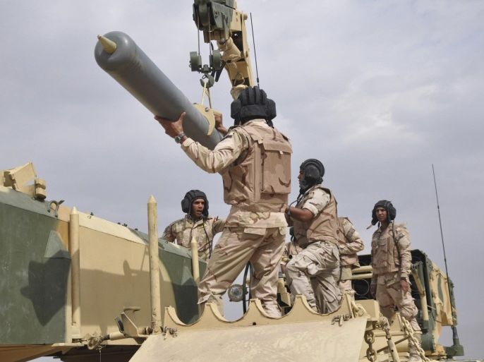 Iraqi Army soldiers work in a Russian-made multiple rocket launcher known as the TOS-1A during training at a military camp in Baghdad October 14, 2014. The Iraqi army will deploy the weapon to the frontlines, the country's ministry of defence said. Picture taken October 14, 2014. REUTERS/Stringer (IRAQ - Tags: MILITARY)