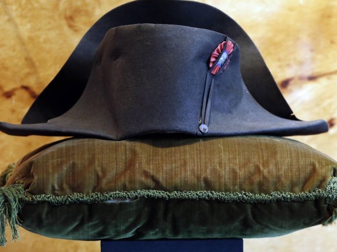 A black felt two-cornered hat belonging to French Emperor Napoleon Bonaparte is displayed at the Osenat auction house in Paris October 24, 2014. Napoleon's black felt bicorne hat is one of nearly 1,000 objects to be auctioned on November 15th and 16 in Fontainebleau, south of Paris. The bicorne is part of a collection belonging to Louis II of Monaco, the great-grandfather of Prince Albert II, and was on display in the Principality's Palace Museum. Napoleon's bicorne, with its gray-green silk lining, said to have been worn during the Battle of Marengo in Italy in 1800, is expected to be sold for between �300,000 to �400,000 ($379,900 - $506,500). REUTERS/Charles Platiau (FRANCE - Tags: SOCIETY ROYALS)