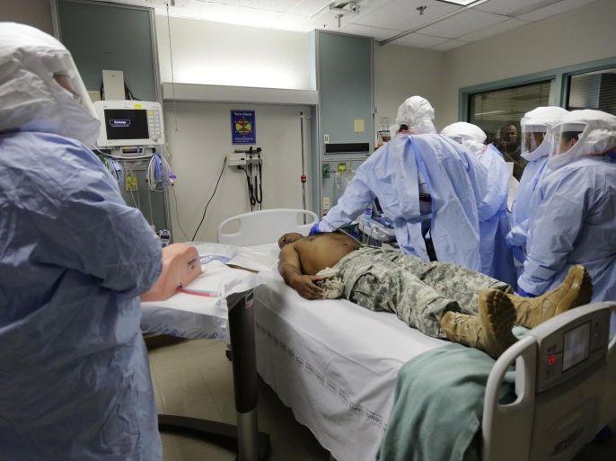Members of the Department of Defense's Ebola Military Medical Support Team go through special training at San Antonio Military Medical Center, Friday, Oct. 24, 2014, in San Antonio. The team will consist of 20 critical care nurses, 5 doctors trained in infectious disease, and 5 trainers in infectious disease protocols. (AP Photo/Eric Gay)