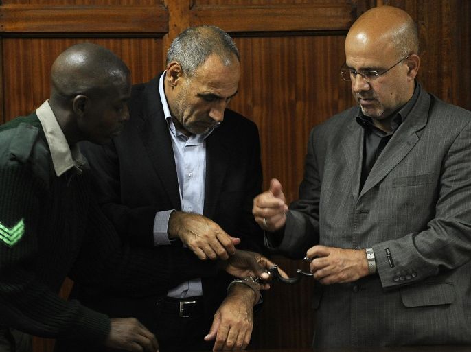 Sayed Mansour Mousavi, (L) and Ahmad Abolfathi Mohammed, both Iranian nationals, are handcuffed moments after being sentenced to life in prison on terror-related charges, including the possession of explosives allegedly for use in bomb attacks, on May 6, 2013 during their trial in Nairobi. A Kenyan court sentenced two Iranians to life in prison on terror-related charges, including the possession of explosives allegedly to be used in bomb attacks.'I shudder to imagine the amount of damage that could have been seen,' judge Kiarie Waweru Kiarie told the court in the capital Nairobi.