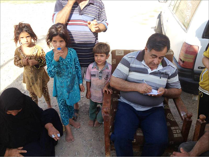 ‪ضمن حملة التلقيح ضد شلل الأطفال في العراق‬ (الجزيرة)