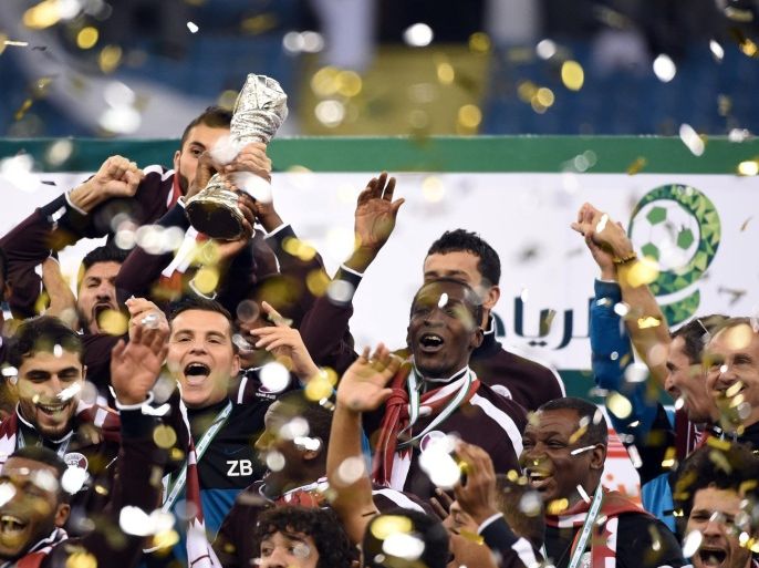 Qatar players celebrate with the Gulf cup trophy after defeating Saudi Arabia 2-1 in the final of the 22nd Gulf Cup football match at the King Fahad stadium in Riyadh, on November 26, 2014. AFP PHOTO/ FAYEZ NURELDINE