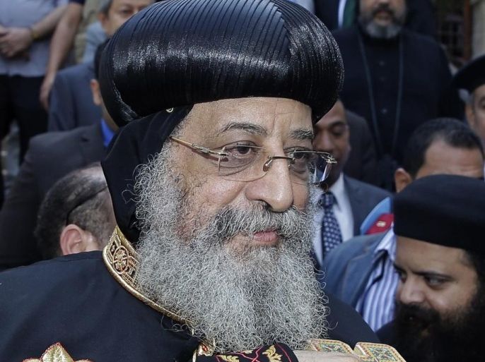 Pope Tawadros II, the Patriarch of the Coptic Orthodox Church, attends a ceremony marking the end of a $5.4 million restoration project of the Hanging Church in Cairo, Egypt, Saturday, Oct. 11, 2014. Egyptian officials are celebrating the completion of a 16-year old restoration project of Saint Virgin Mary's Coptic Church, also known as Hanging Church, one of the oldest in the country that owes the nickname to the fact that it rests above a gatehouse of a 2nd century Roman fortress. The church lies in a complex housing one of the oldest synagogues and the first mosque built in Cairo. (AP Photo/Hassan Ammar)