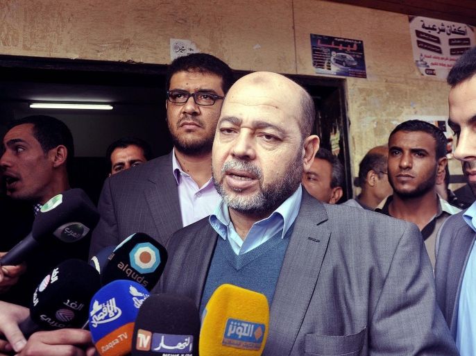 GAZA CITY, GAZA - DECEMBER 06: Palestinian senior member of Hamas, Mousa Abu Marzook (C) speaks to the press after his visiting of the patients at Al-Shifa Hospital in Gaza City, Gaza on December 06, 2014.