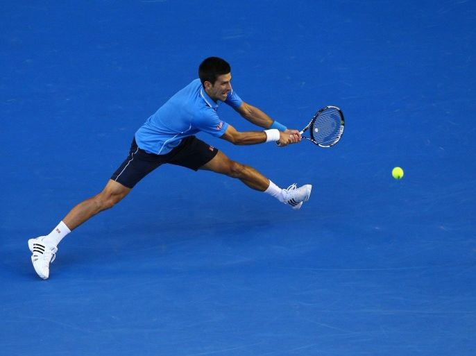 MELBOURNE, AUSTRALIA - JANUARY 30: Novak Djokovic of Serbia plays a backhand in his semifinal match against Stanislas Wawrinka of Switzerland during day 12 of the 2015 Australian Open at Melbourne Park on January 30, 2015 in Melbourne, Australia.