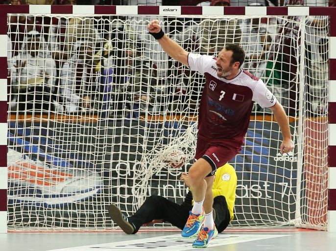 Qatar's Bertrand Roine celebrates after scoring a goal during the 24th Men's Handball World Championships semi-finals match between Qatar and Poland at the Lusail Multipurpose Hall in Doha on January 30, 2015. AFP PHOTO / AL-WATAN DOHA / KARIM JAAFAR==QATAR OUT==