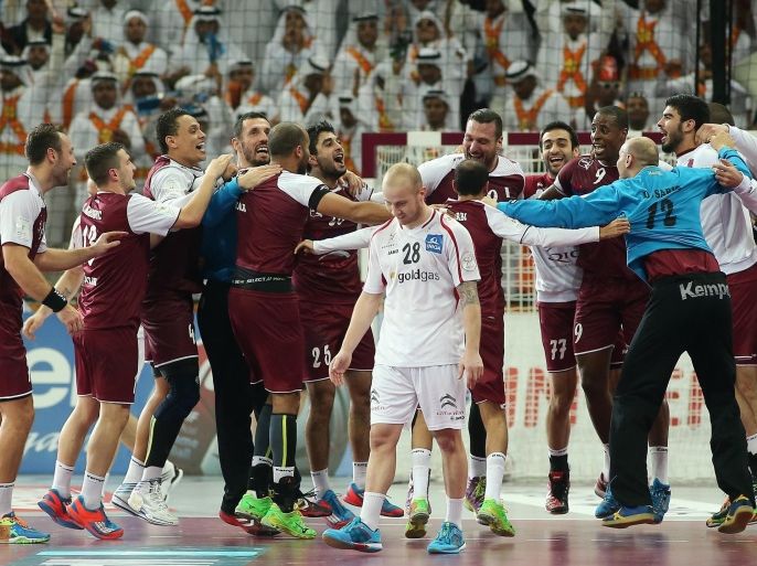 Qatar's players celebrate their win during the 24th Men's Handball World Championships Eighth Final EF3 match between Austria and Qatar at the Lusail Multipurpose Hall in Doha on January 25, 2015. AFP PHOTO / AL-WATAN DOHA / KARIM JAAFAR==QATAR OUT==