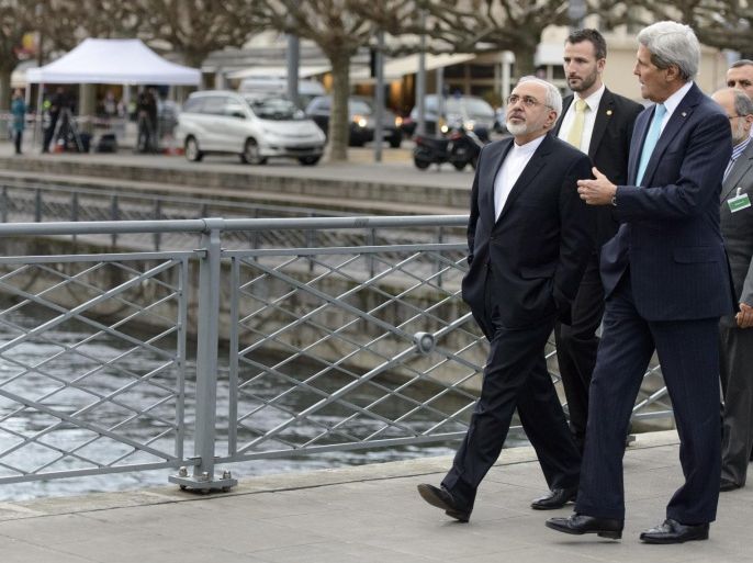 US Secretary of State John Kerry, right, speaks with Iranian Foreign Minister Mohammad Javad Zarif, as they walk in the city of Geneva, Switzerland, Wednesday, Jan. 14, 2015, during a bilateral meeting ahead of the next round of nuclear discussions. (AP Photo/Keystone,Laurent Gillieron)