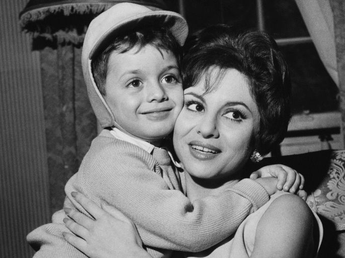 Egyptian actress Faten Hamama with her four-year-old son Tarek during a press conference in London, 22nd November 1961. Tarek's father is actor Omar Sharif. Hamama is in the capital to discuss her plans as a movie producer.