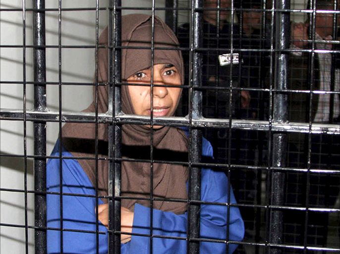 epa00697595 Sajida Mubarak al-Rishawi. the woman suicide-bomber who failed to blow herself up in a Jordanian hotel in 2005 went on trial, charged for the attacks that killed 63 people, in Amman Monday 24 April 2006. Sajida Mubarak al-Rishawi, 35, is standing trial for the near simultaneous attacks on three hotels in Amman on November in which she, her husband and two other suicide bombers took part. Al-Rishawi's explosives-belt failed to detonate and she was arrested after fleeing the scene. On Monday she stood in the dock alone as she is the only one of the eight defendants who is in custody. EPA/PETRA, JORDAN NEWS AGENCY
