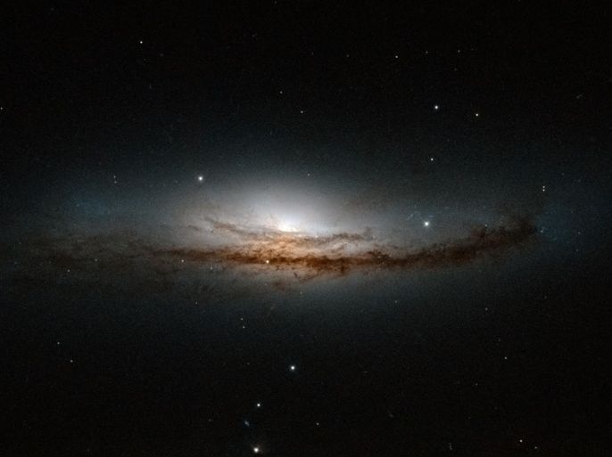 The spiral galaxy NGC 5793, more than 150 million light-years away in the constellation of Libra is pictured in this undated handout image from NASA's Hubble telescope obtained by Reuters March 21, 2014. NGC 5793 is a Seyfert galaxy. These galaxies have incredibly luminous centres that are thought to be caused by hungry supermassive black holes � black holes that can be billions of times the size of the Sun � that pull in and devour gas and dust from their surroundings. REUTERS/NASA/Handout (OUTER SPACE - Tags: SCIENCE TECHNOLOGY) THIS IMAGE HAS BEEN SUPPLIED BY A THIRD PARTY. IT IS DISTRIBUTED, EXACTLY AS RECEIVED BY REUTERS, AS A SERVICE TO CLIENTS. FOR EDITORIAL USE ONLY. NOT FOR SALE FOR MARKETING OR ADVERTISING CAMPAIGNS