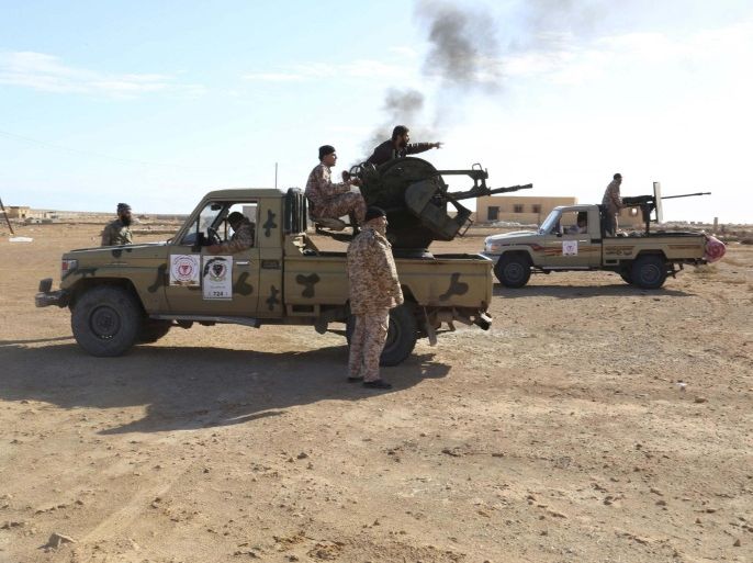 Libyan Army Forces belonging to Libya's rival government, that are part of the Alshorooq (Libya Dawn) operation to free oil ports, are seen on the outskirts of Al Sidra oil port December 14, 2014. Picture taken December 14, 2014. REUTERS/Stringer (LIBYA - Tags: POLITICS CONFLICT MILITARY)