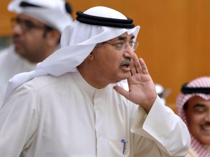 Kuwaiti deputy prime minister and Minister of Commerce and Industry Abdulmohsen al-Mudej attends a parliament session at Kuwait's national assembly in Kuwait City on March 24, 2015. Mudej resigned on March 25, 2015 two days after a lawmaker demanded to grill him, becoming the second minister to resign in two weeks. AFP PHOTO / YASSER AL-ZAYYAT