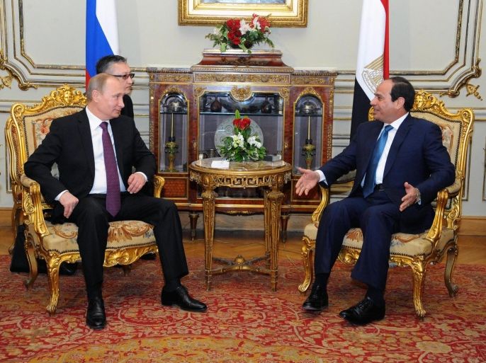 In this image released by the Egyptian Presidency, Egyptian President Abdel-Fattah el-Sissi, right, and Russian President Vladimir Putin, meet at the presidential palace in Cairo Egypt, Tuesday, Feb. 10, 2015. The presidents of Egypt and Russia on Tuesday said the two countries would build Egypt's first nuclear power plant together and boost natural gas trade and other ties. (AP Photo/Egyptian Presidency)