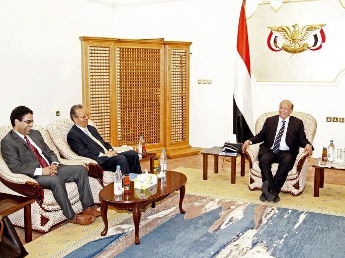 Yemen's embattled President Abed Rabbo Mansour Hadi, right, meets U.N. envoy to Yemen, Jamal Benomar, left, at the Republican Palace in the southern port city of Aden, Yemen, Thursday, Feb. 26, 2015. Aides to Yemen's embattled Hadi say he has met with the U.N. envoy to the country for the first time since fleeing the Shiite rebel-held capital. (AP Photo)
